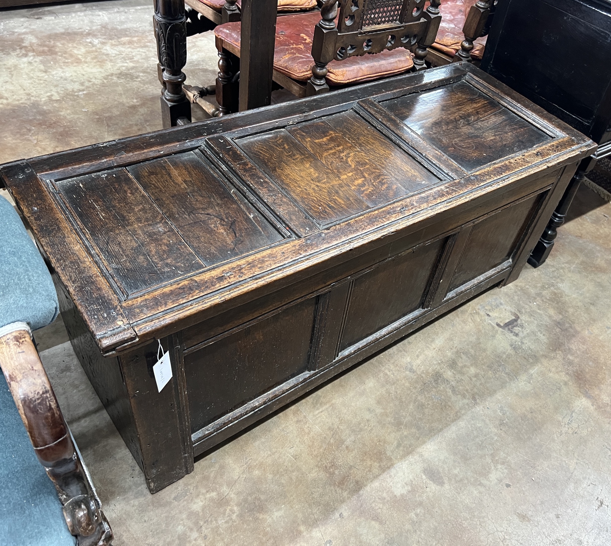 A late 17th / early 18th century panelled oak coffer, width 125cm, depth 50cm, height 50cm
